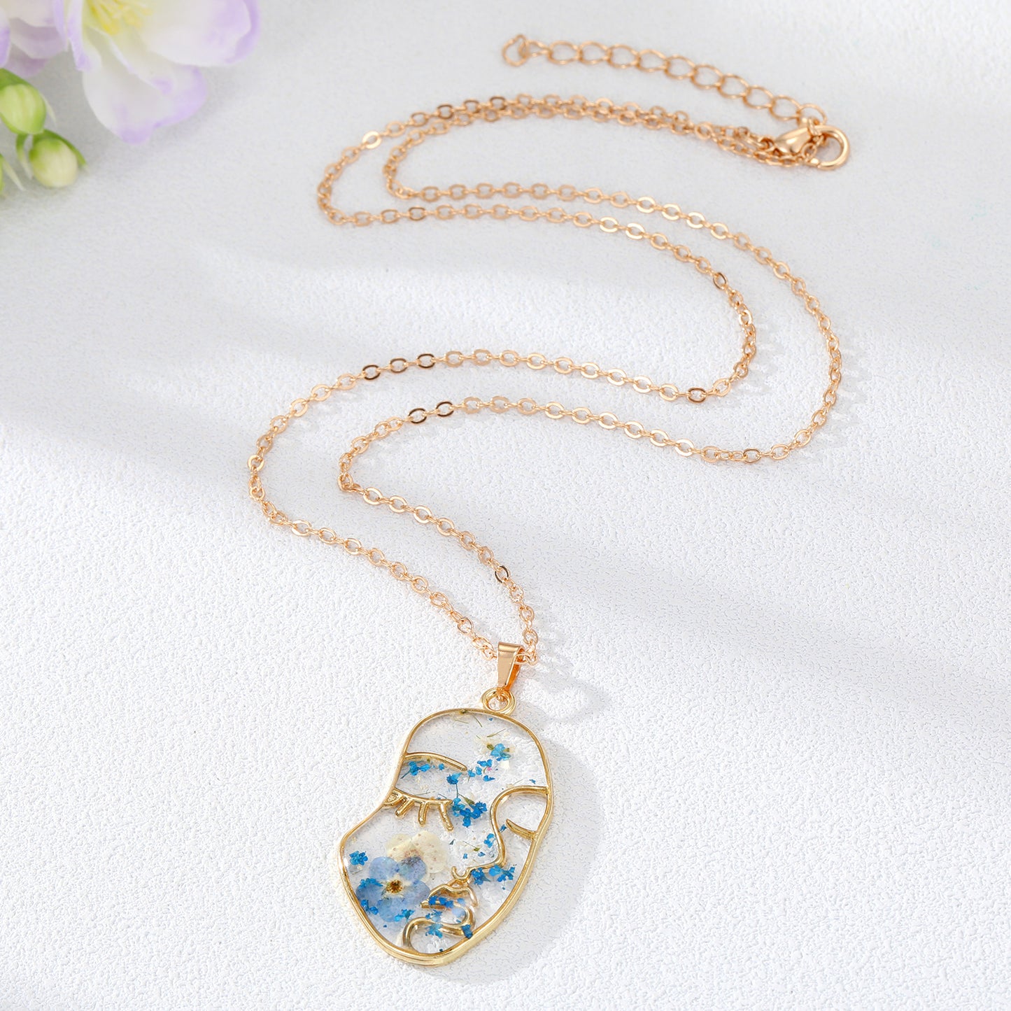 Abstract Face Forget Me Not Flower Necklace