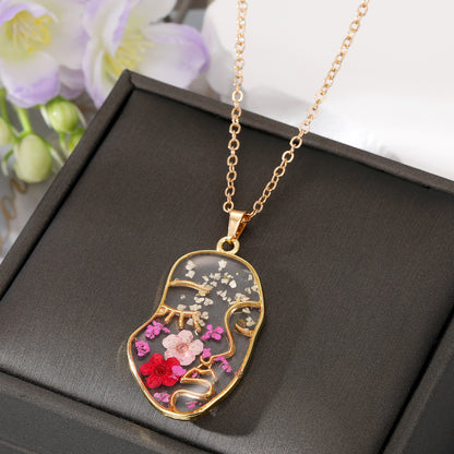 Abstract Face Forget Me Not Flower Necklace