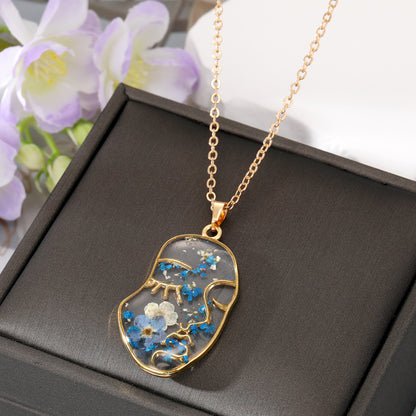 Abstract Face Forget Me Not Flower Necklace